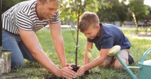 Family planting a memorial tree in honor of a loved one